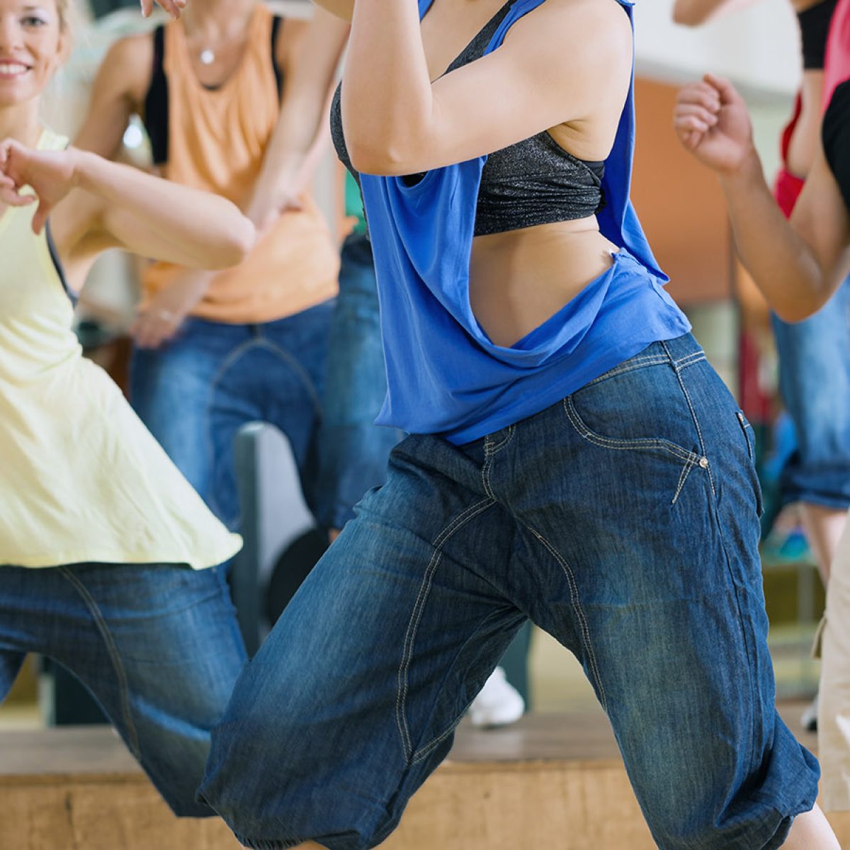 Jazzdance - young people dancing in a studio or gym doing sports or practicing a dance number